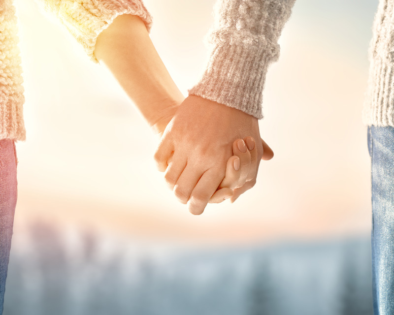 Couple holding hands - Neurodiverse couples therapy can be effective